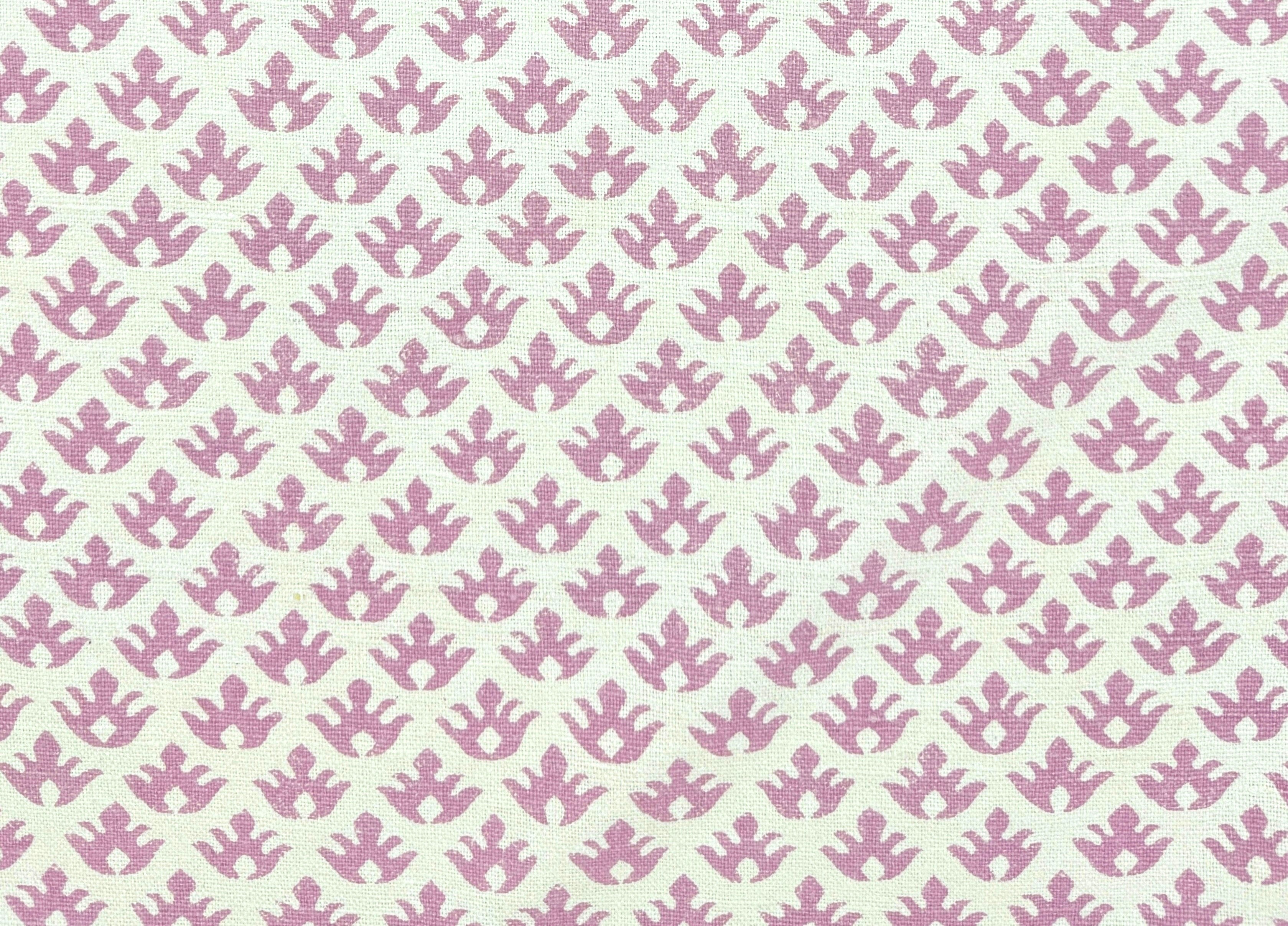 Pattern of small pink crowns on a cream colored background