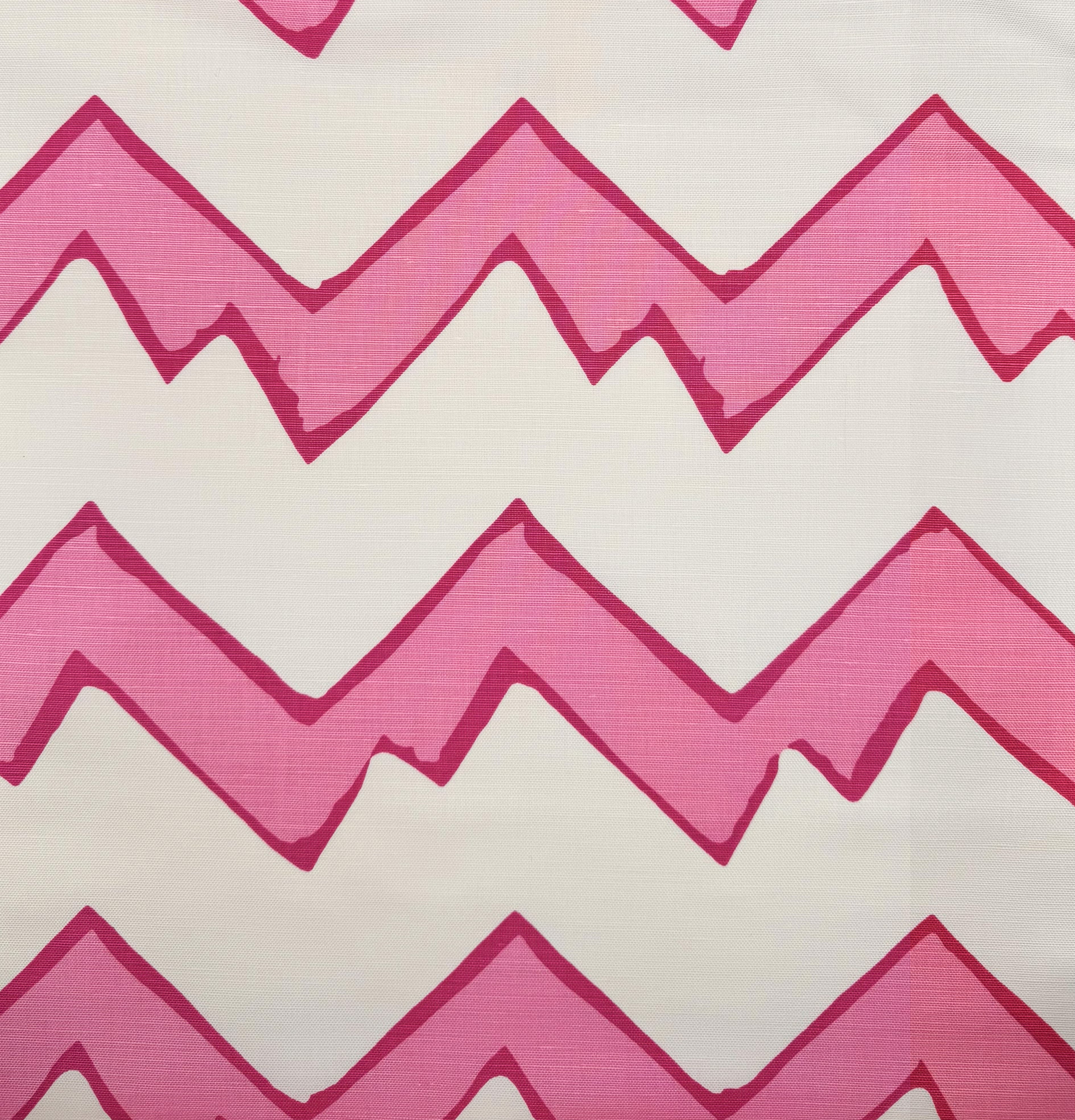 Pattern of pink and white chevron stripes on a textured fabric background