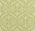 A close-up view of a fabric featuring a traditional damask print with floral and leaf motifs in a custom French green color on a tinted background.