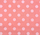 Pink fabric with white polka dots
