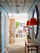 We look upon this 'Lyford Trellis' and we see a grid that attempts to impose order upon a nature that is fundamentally chaotic and indifferent. The green of the wallpaper is not the green of a gentle garden; it is the green of a jungle that is waiting for the designer to close his eyes so it may reclaim the hallway. Fondas has created a barricade of geometry against the void. It is a festive defiance. We walk through this corridor and we realize that the trellis is not merely decoration—it is a cage for the