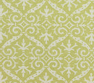 A close-up view of a fabric featuring a traditional damask print with floral and leaf motifs in a custom French green color on a tinted background.